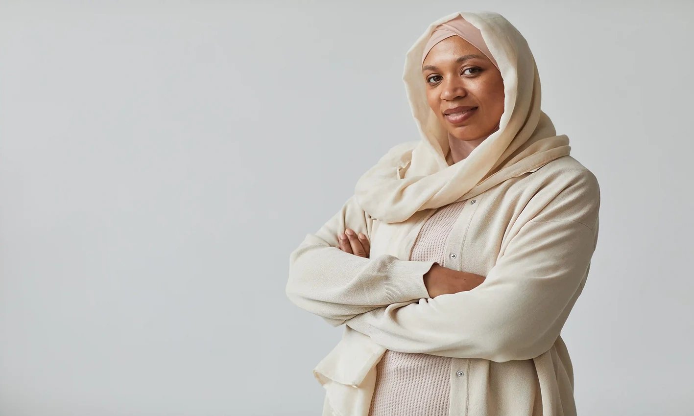 A woman wearing a crinkle scarf by Q&S Islamic Store.